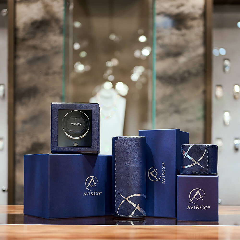 Avi & Co. Luxury Watch Accessories Including a Watch Winder, Watch Roll, and Leather Watch Display
