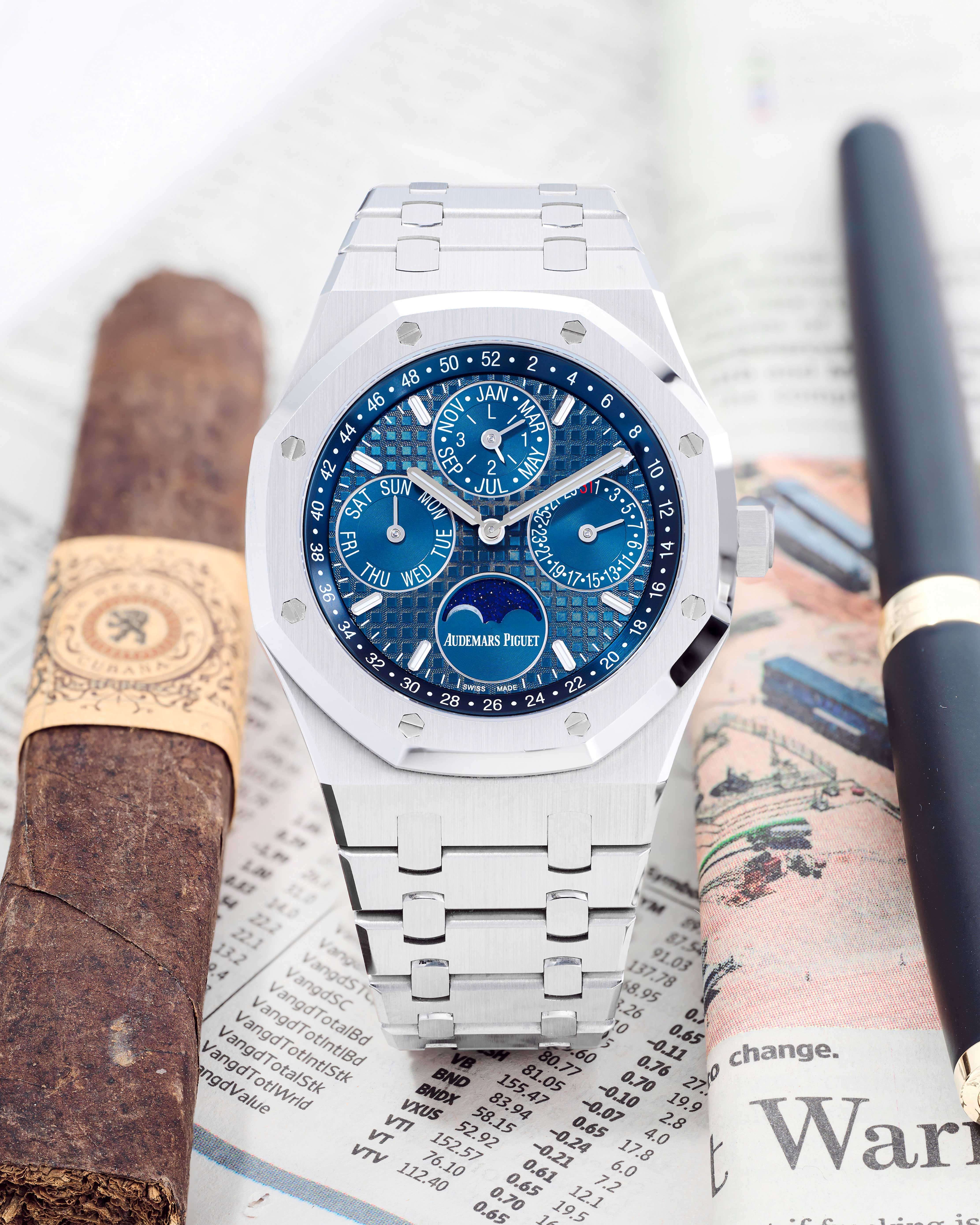Stainless Steel 41 mm case, Fixed Matching Bezel, Night Blue Dial on a Newspaper with Cigar and Black Pen