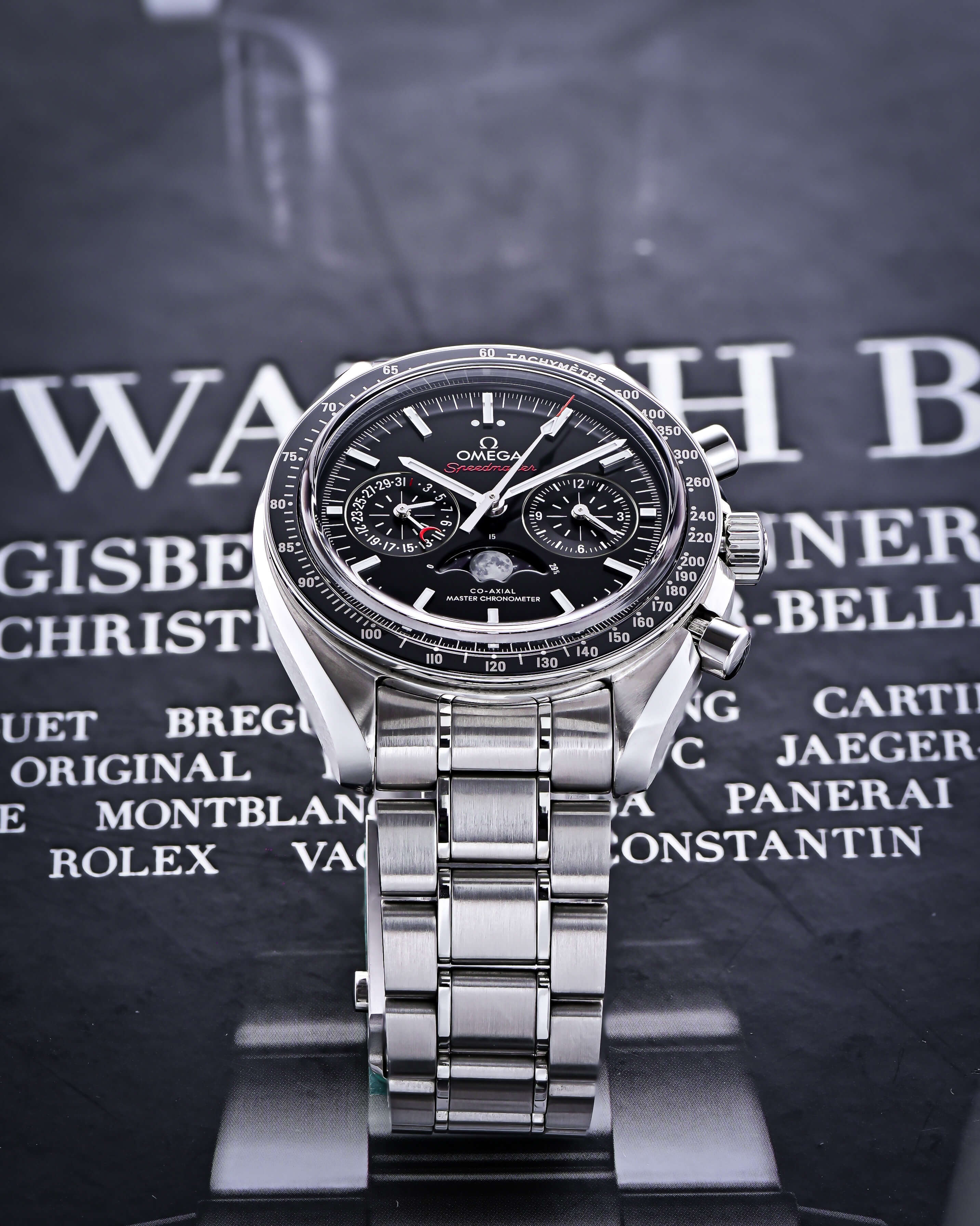Stainless Steel 44 mm Case, Tachymeter Ceramic Bezel with 3 Dials on a Black and White Background