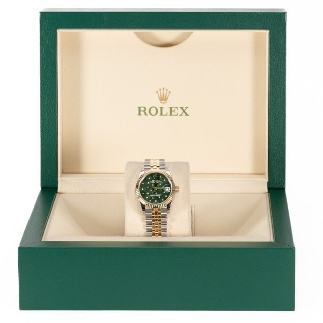Rolex Lady-Datejust with a Stainless Steel and 18K Yellow Gold 31 mm Case, Green Floral Motif Dial, and Yellow Gold Bezel Displayed in a Green Rolex Box