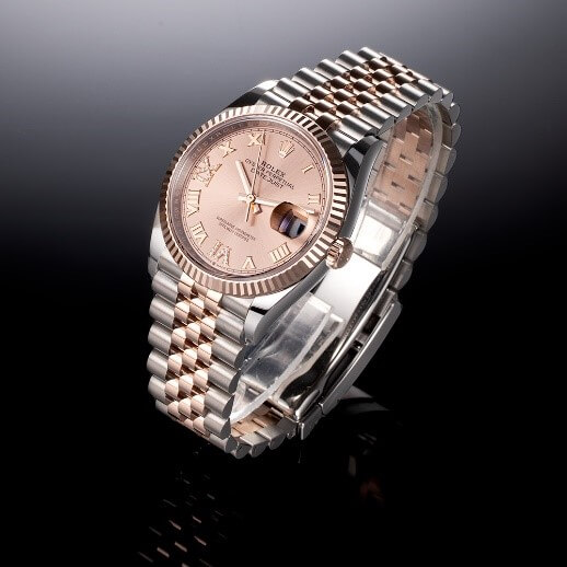 Rolex Datejust 36 with a Stainless Steel and 18K Rose Gold 36 mm Case, Rose Roman Dial, and Fixed, Everose Gold Bezel on a Black Background