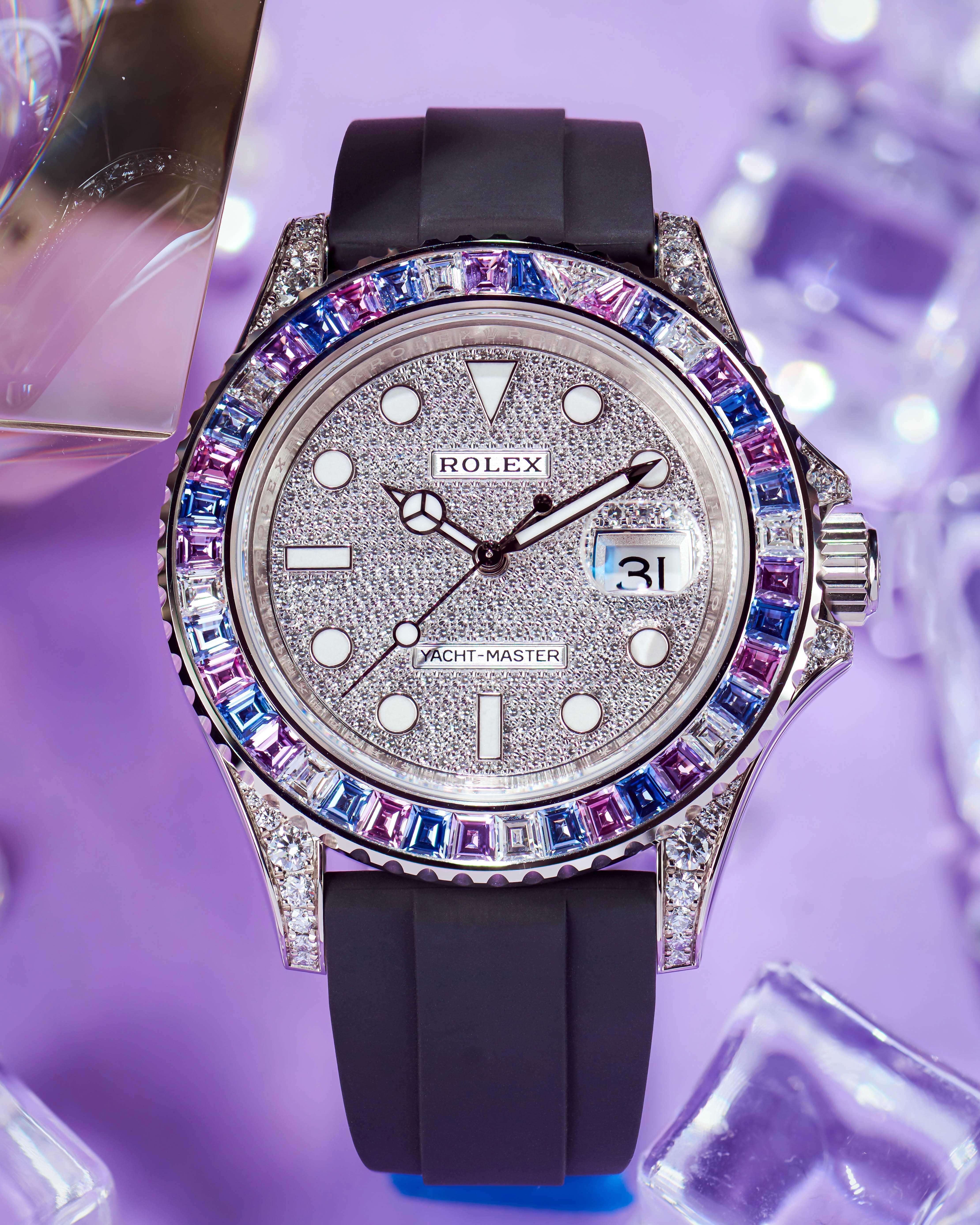 Diamond Pave Dial, Sapphire Bezel, Black Rubber Strap on a Purple Background with Diamonds