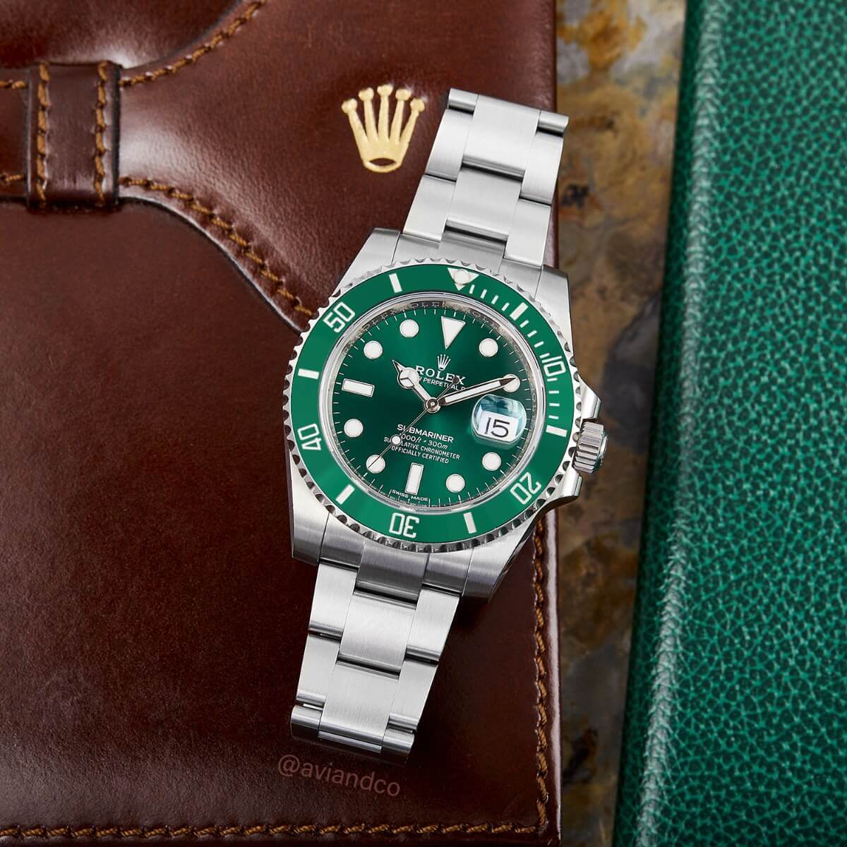 Rolex Submariner, Oystersteel, Green Hulk Dial on a Brown Leather Briefcase
