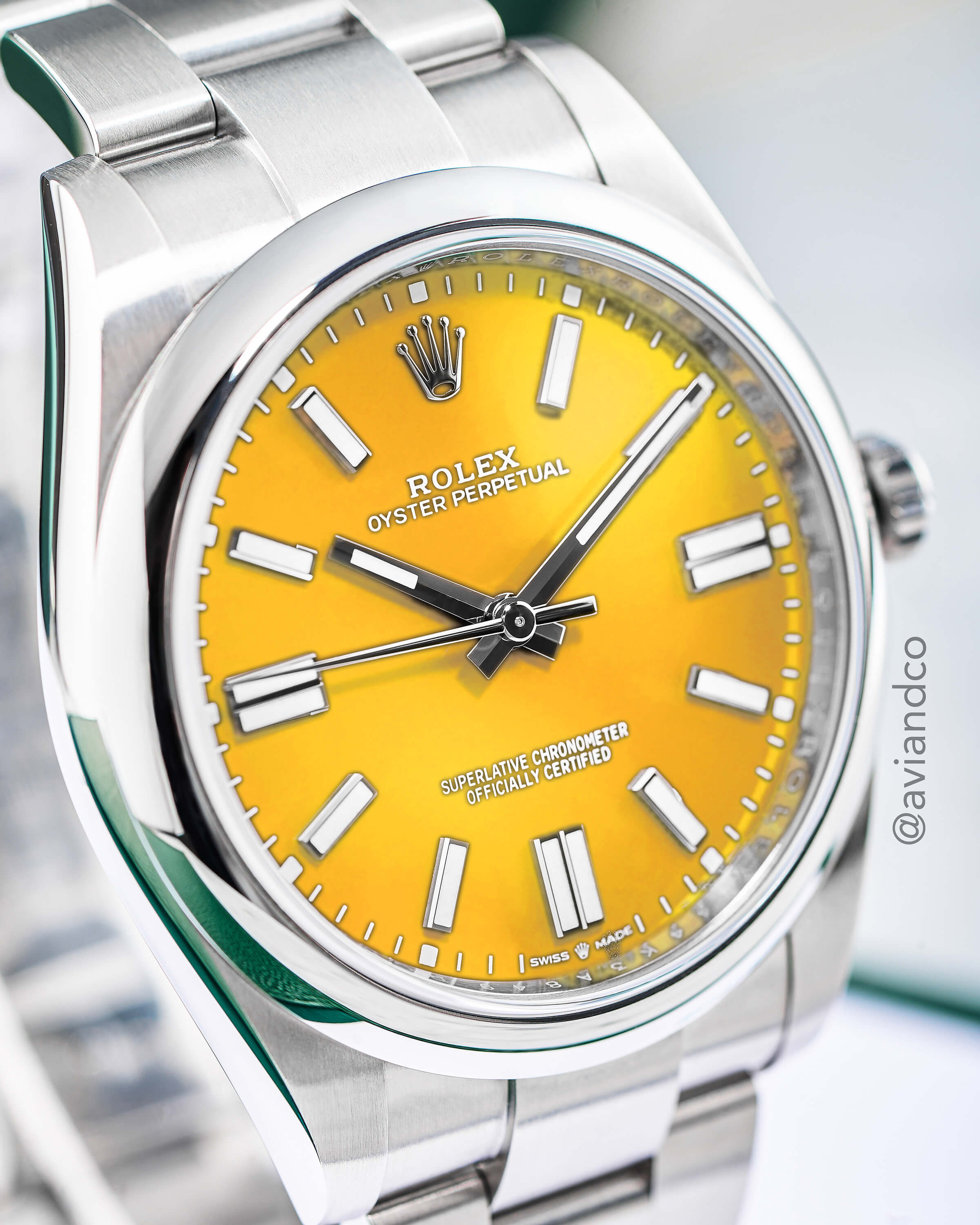 Rolex Oyster Perpetual, Steel, Yellow Index Dial on a Display Ring