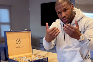 American Boxer Floyd Mayweather Wears the Avi & Co. Limited Edition White Gold AH17 44 mm Timepiece While Sharing his Diamond-Pave Watch Collection.