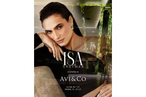 Model and Entrepreneur Isa Grutman Posing in Front of Avi & Co.'s Miami Showroom, Announcing the Start of their Jewelry Partnership.