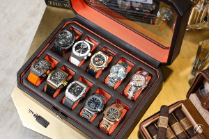 Rolex, Richard Mille, Audemars Piguet, and Patek Philippe watches in a watch box