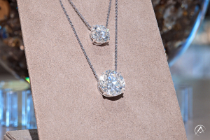 Two Avi & Co. diamond pendant necklaces layered jewelry