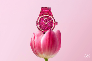 Avi & Co. Hue Collection red ruby watch coming out of a tulip on a pink background for Mother's Day