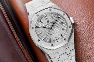 Audemars Piguet Royal Oak, 18K White Gold, Silver Dial, 33 mm on cognac leather background