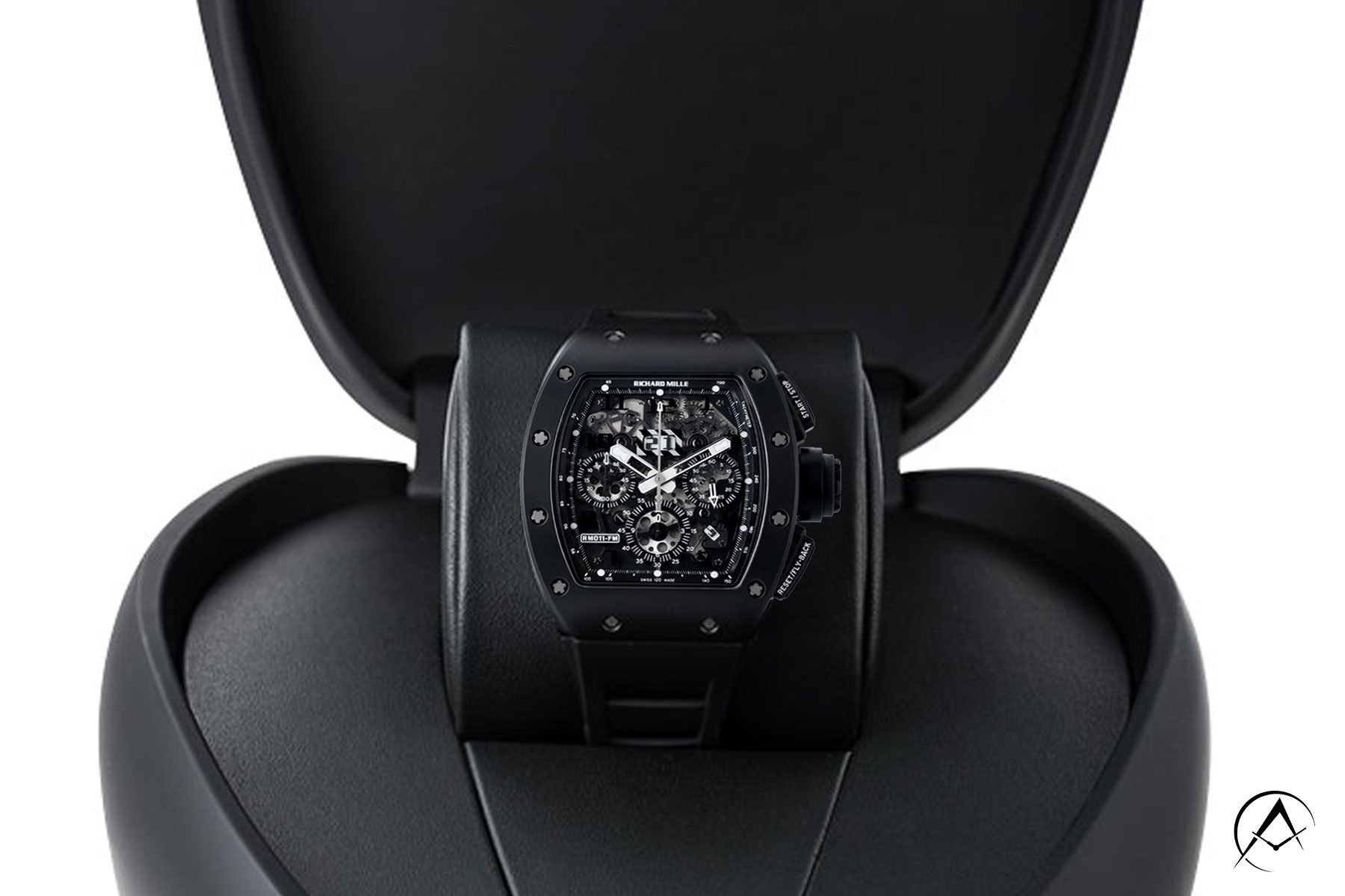 Richard Mille RM 011, Black Phantom Timepiece with 40 mm Black TPT Quartz Case on a Black Cushion Displayed In Black Richard Mille Watch Case.