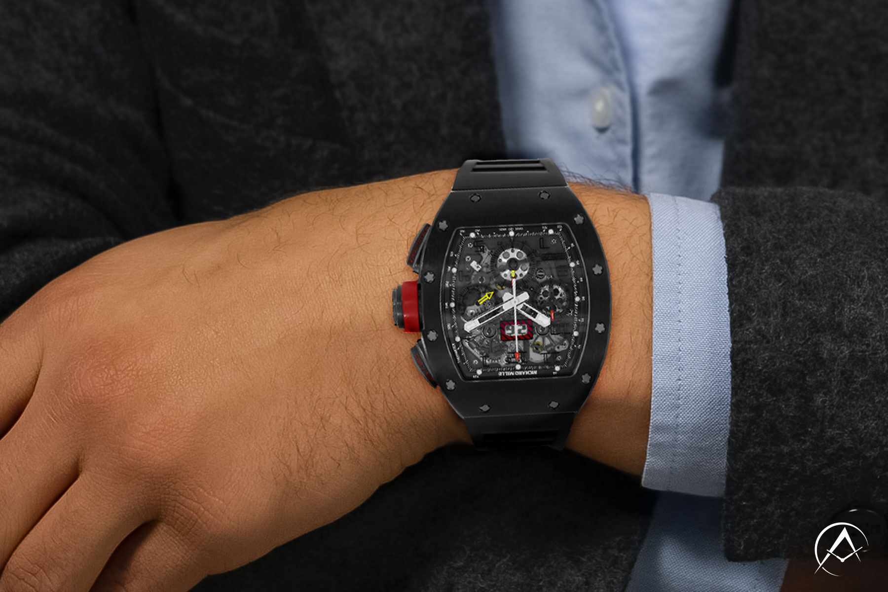 Man Wearing Richard Mille RM 011 on Wrist with Light Blue Button-down Shirt and Gray Suit Jacket.