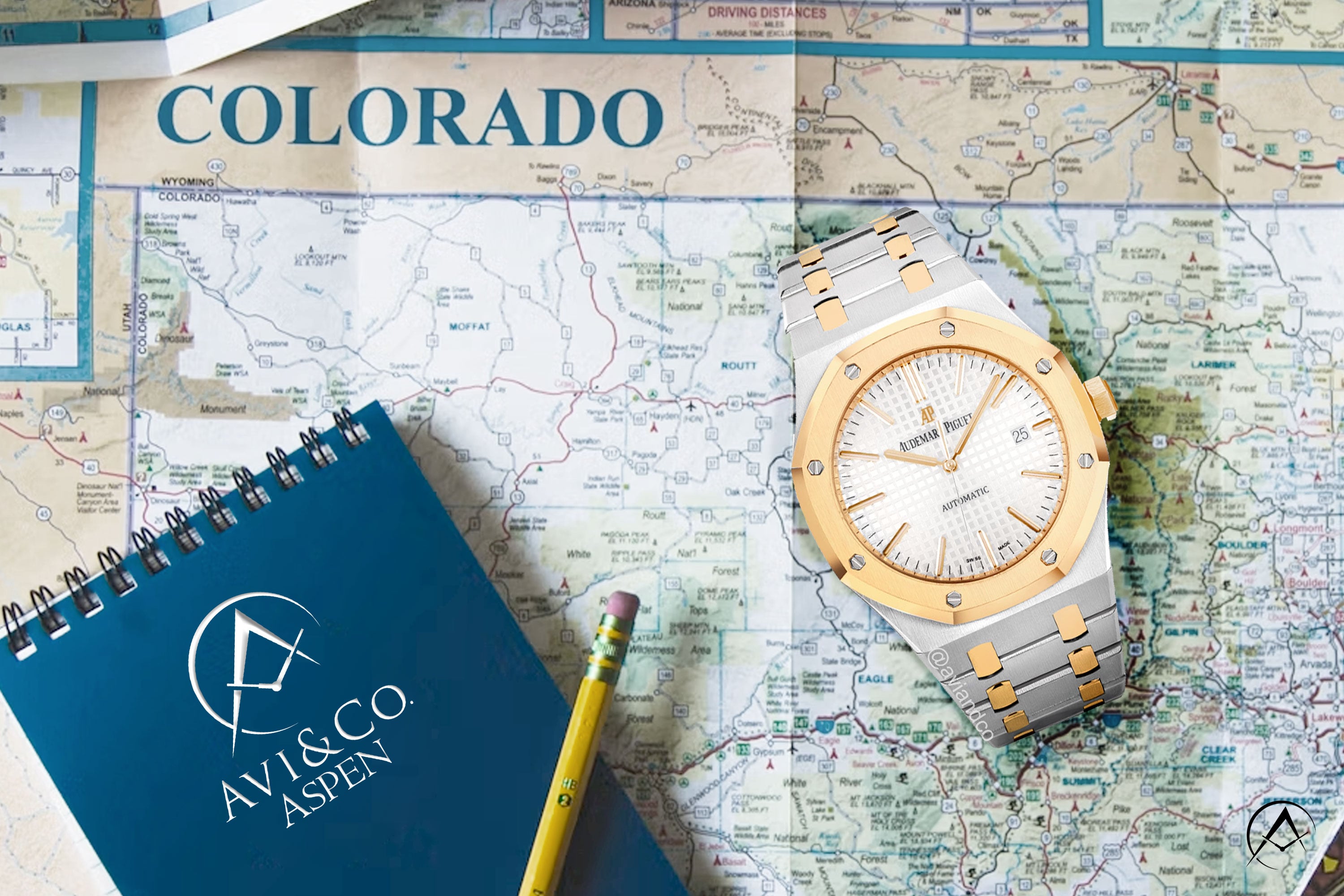 Colorado map in the background of an image with an Audemars Piguet watch and Avi & Co. Aspen notebook