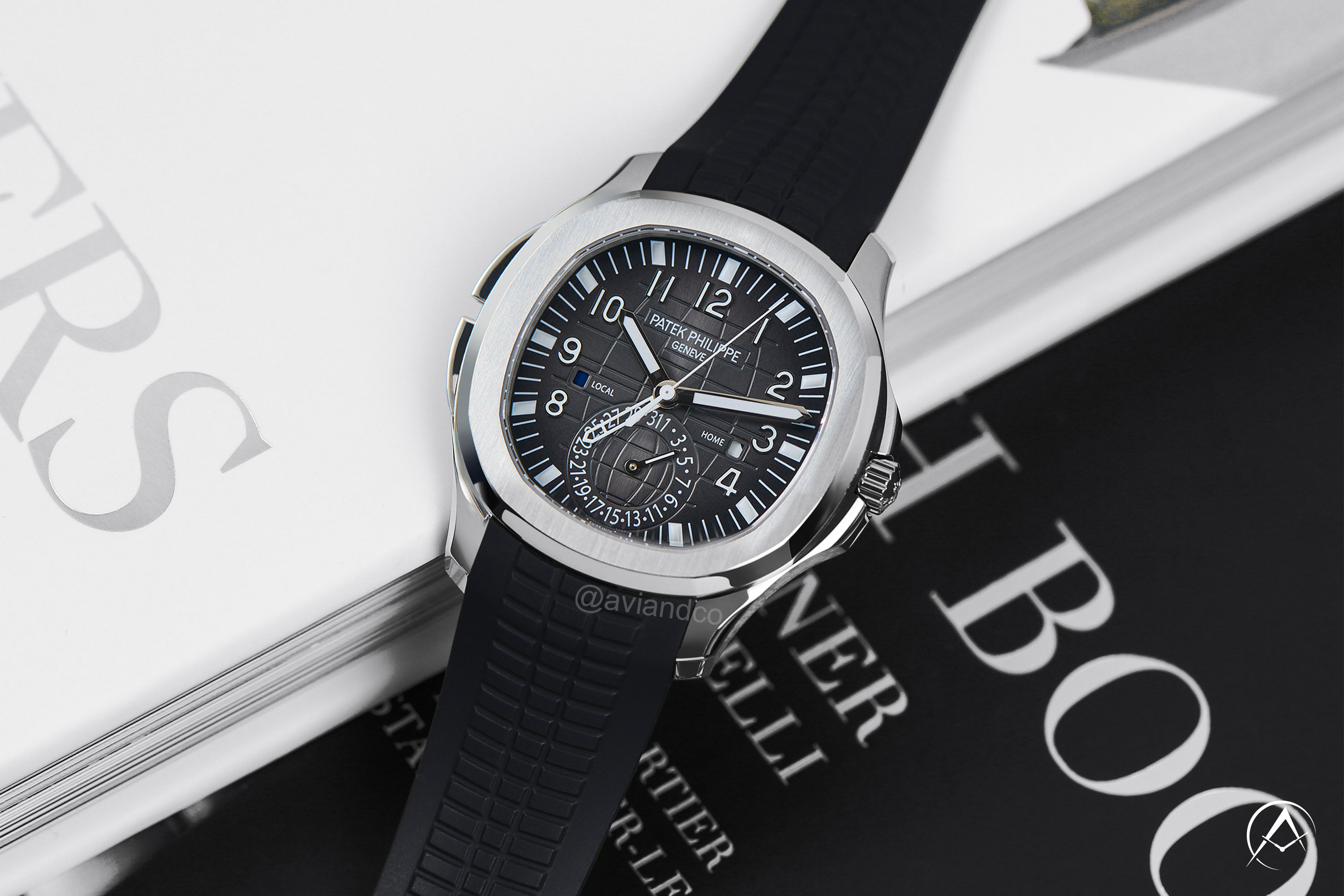 Patek Philippe Aquanaut watch on top of books
