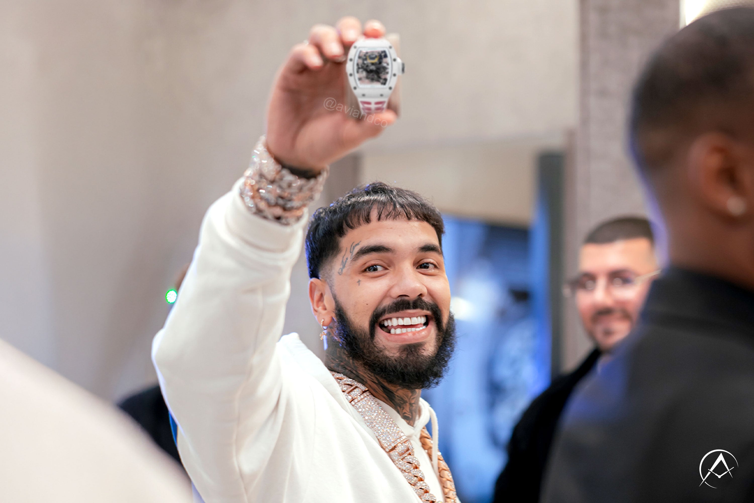 Latin music star Anuel tries on luxury watches, including Richard Mille watches, at Avi & Co.'s Latin Music Week event in Miami