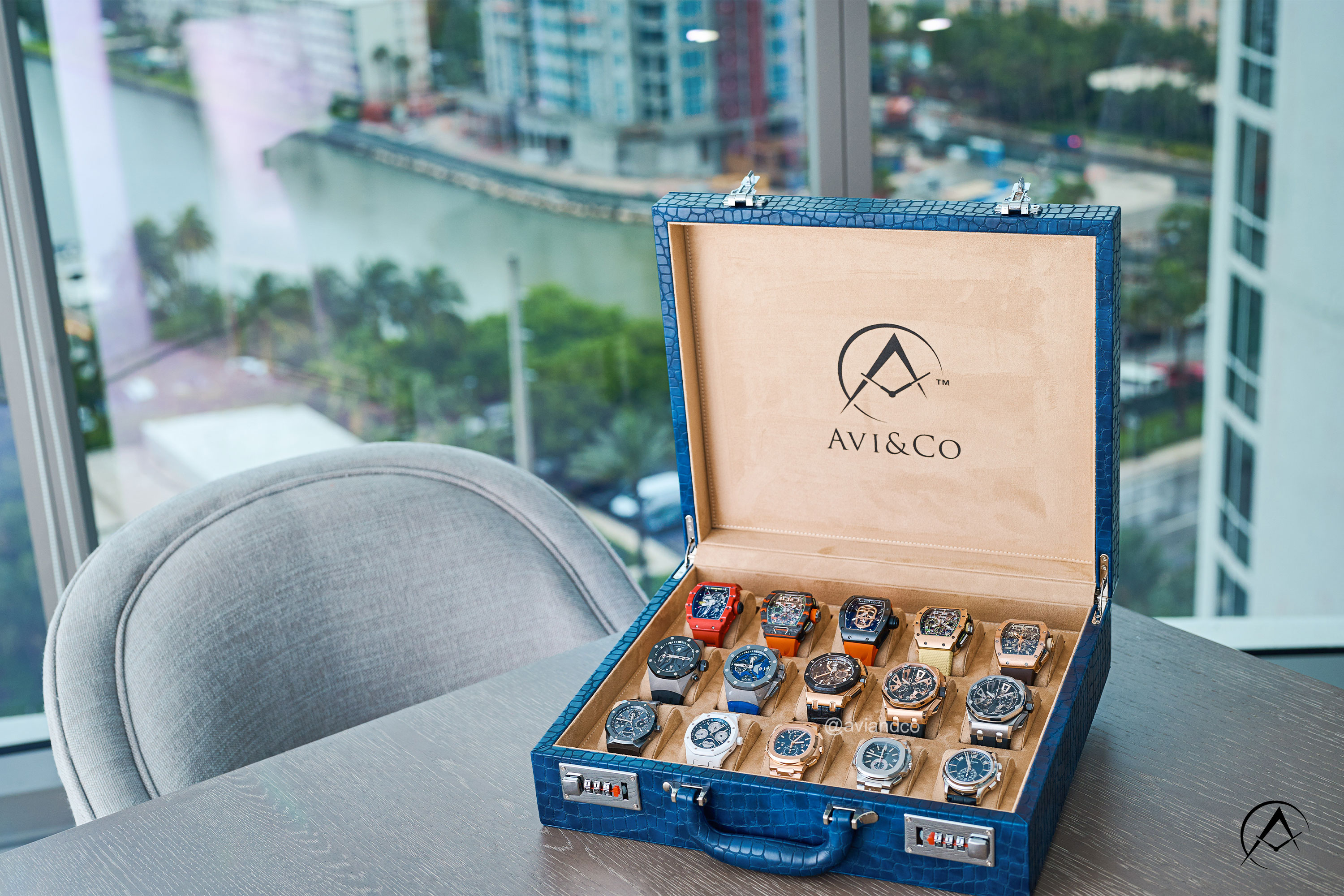 Box of watches for consignment at Avi & Co.