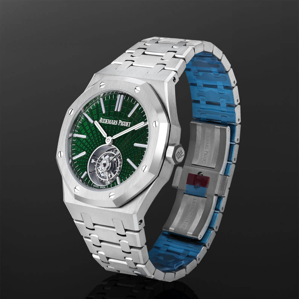 Green Dial Titanium Timepiece Displayed on a C-Ring on a Black Background.