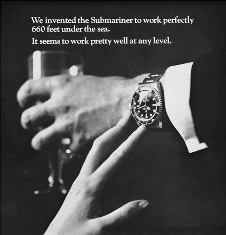 Black and White Photo of Man Wearing Luxury Timepiece with the Text: ‘We Invented the Submariner to Work Perfectly 660 Feet Under the Sea. It Seems to Work Pretty Well at Any Level.’