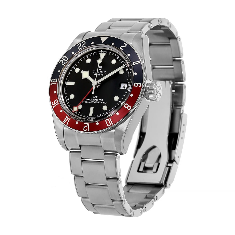 Stainless Steel Timepiece with Black Dial and Two-Tone Bezel Displayed on a Clear C-Ring on a White Background.