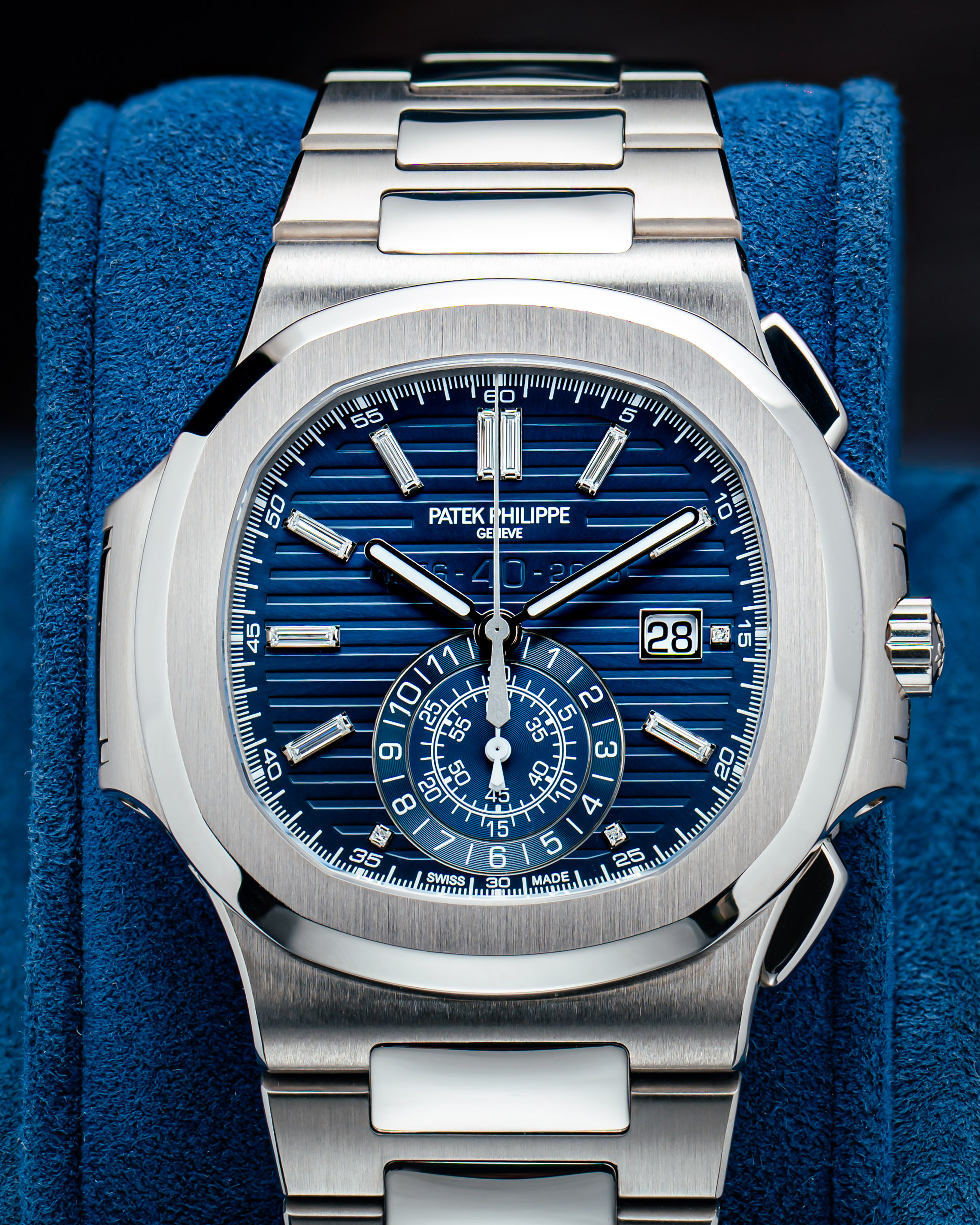 18K White Gold 44 mm Case with Blue Dial, Index Hour Markers, Date Function, and Chronograph Function.