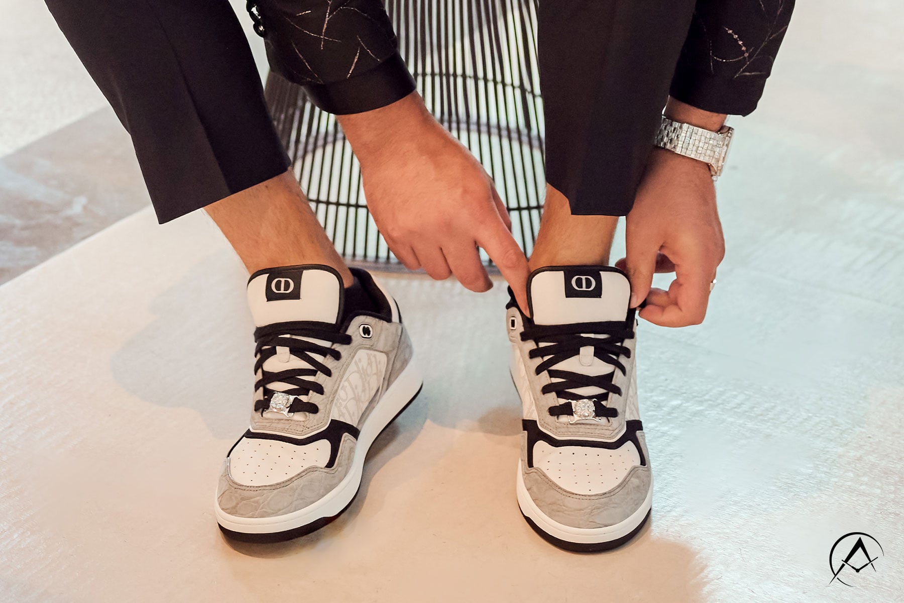 Avi Hiaeve Puts on his Dior Sneakers with 10K Diamonds on Each Shoe While Wearing Avi & Co.’s Limited Edition 18K White Gold Iced Out Timepiece.