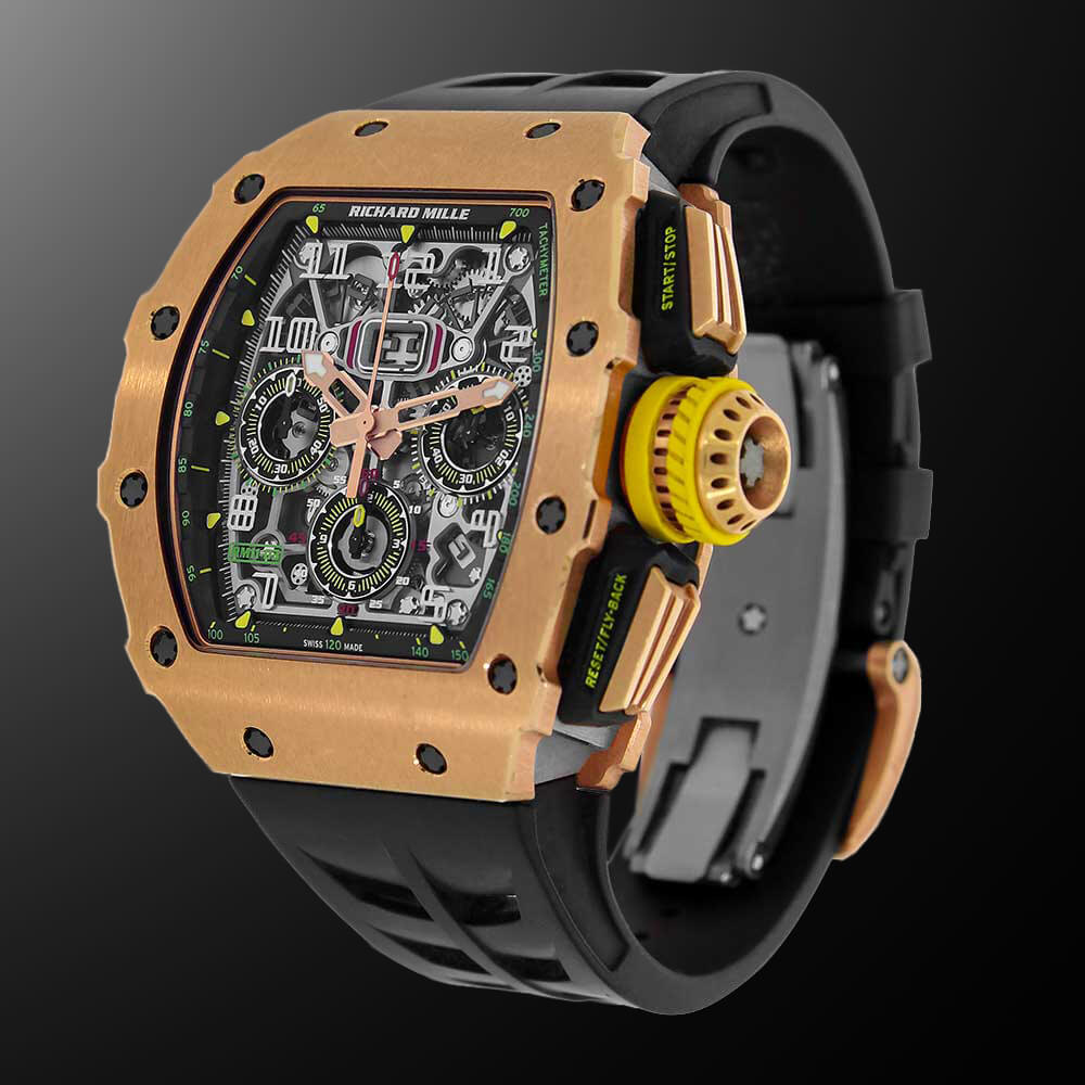Rose Gold Richard Mille Timepiece with Black Rubber Strap Displayed on a C-Ring with a Black Background.