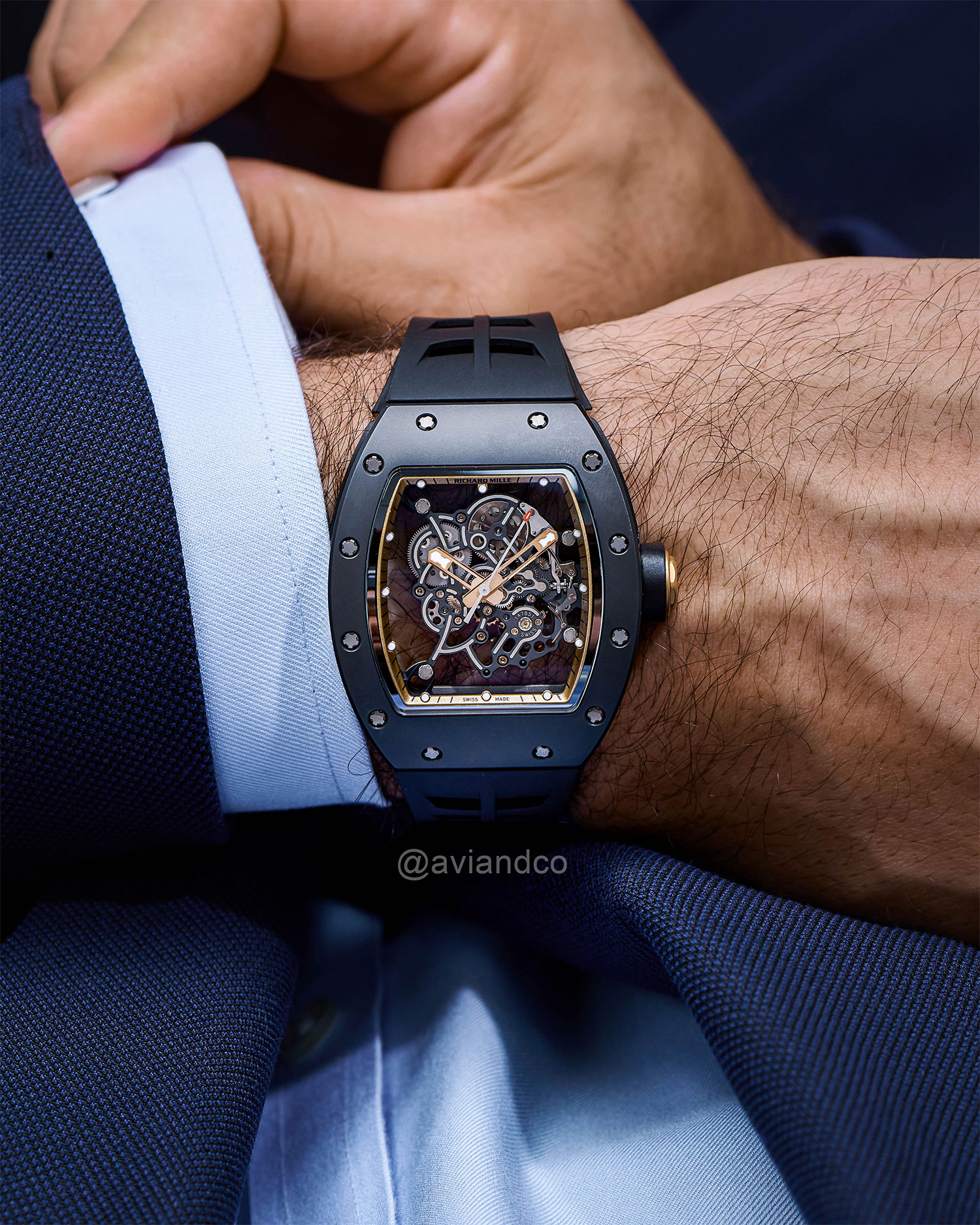 42 mm Asia Edition Richard Mille Timepiece with Transparent Dial, Titanium Case, and Fixed Ceramic Bezel Displayed on a Man’s Wrist.