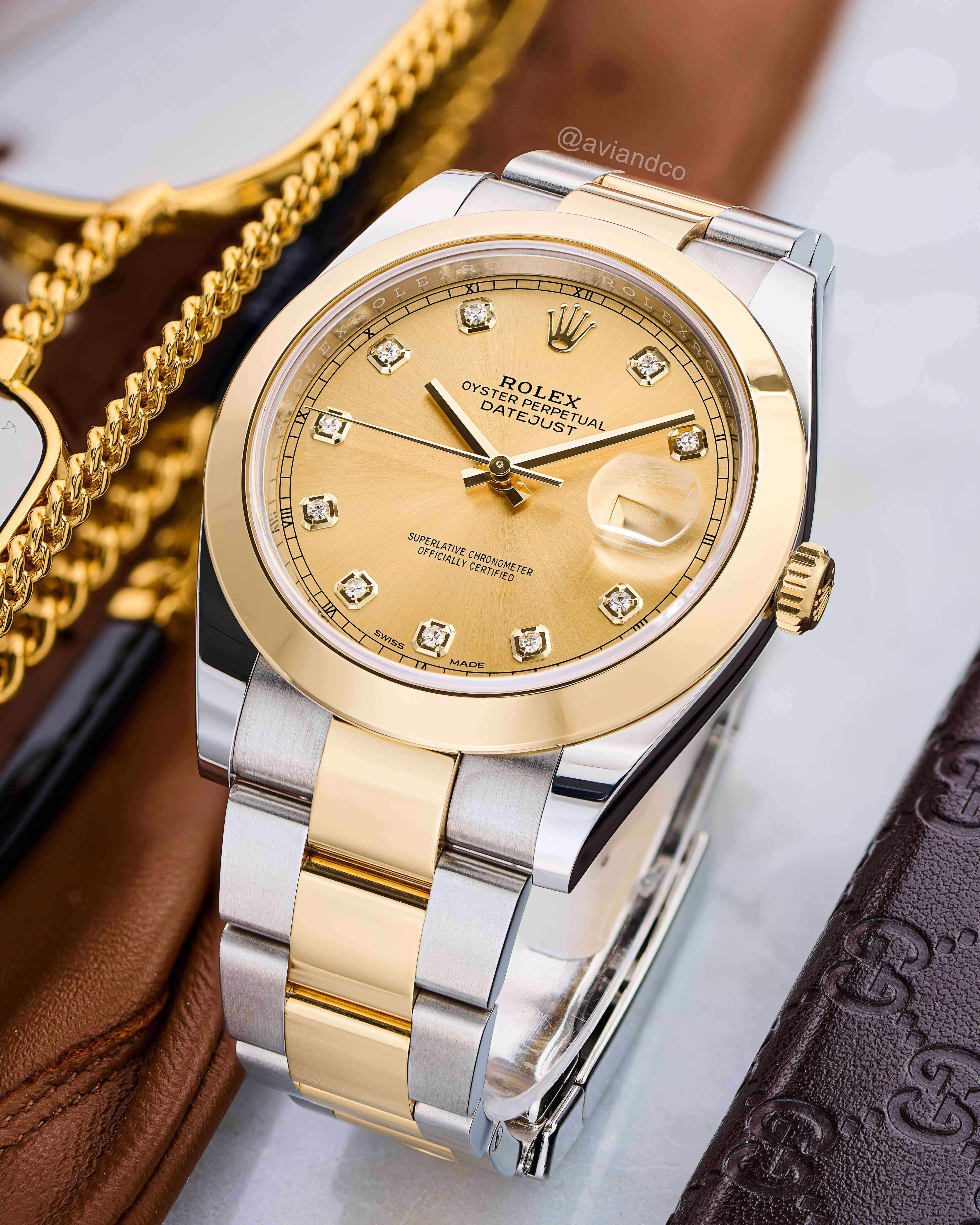 The High-Water Resistance in this Rolex Watch is a Testament to its Durability, Precision, and Style. This Stainless Steel and Yellow Gold 41 mm Champagne Dial with Diamond Hour Markers has an Automatic Movement and Date Function.