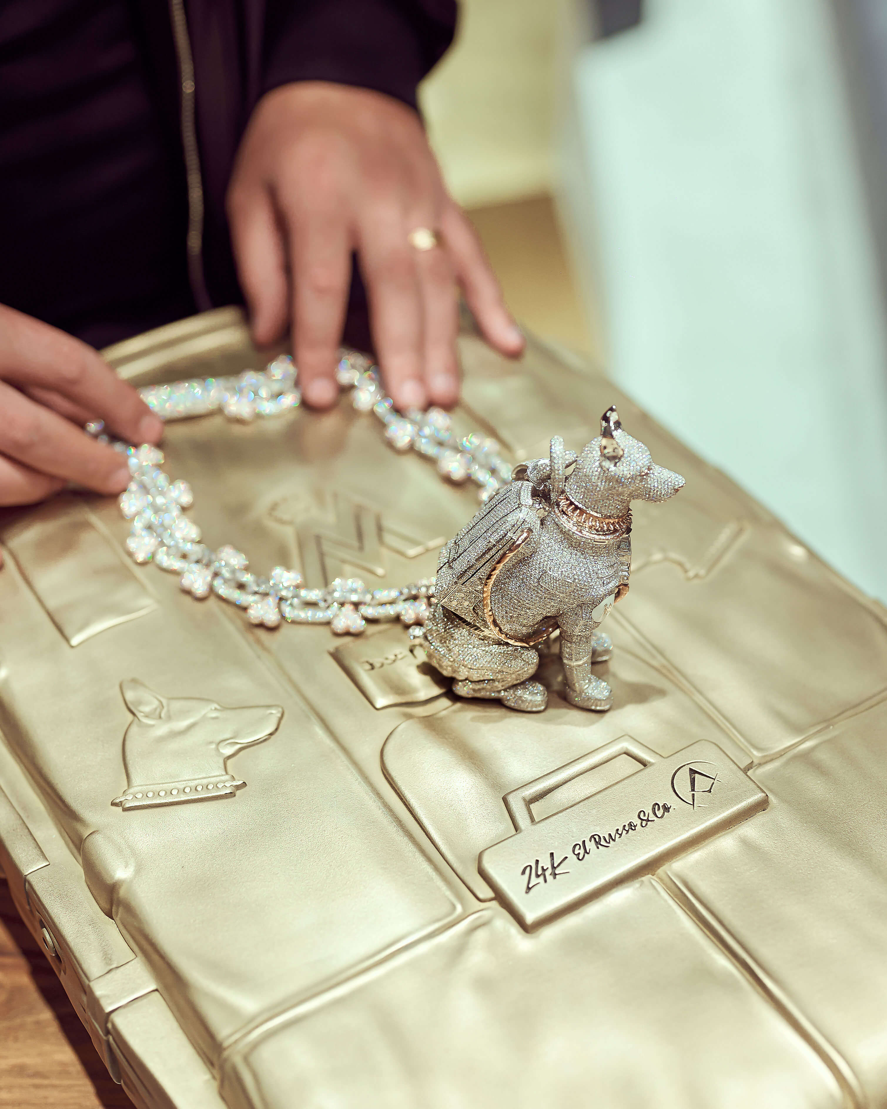 Co-Creator Avi Hiaeve displaying Maluma’s 14k White and Rose Gold Doberman Custom Chain.