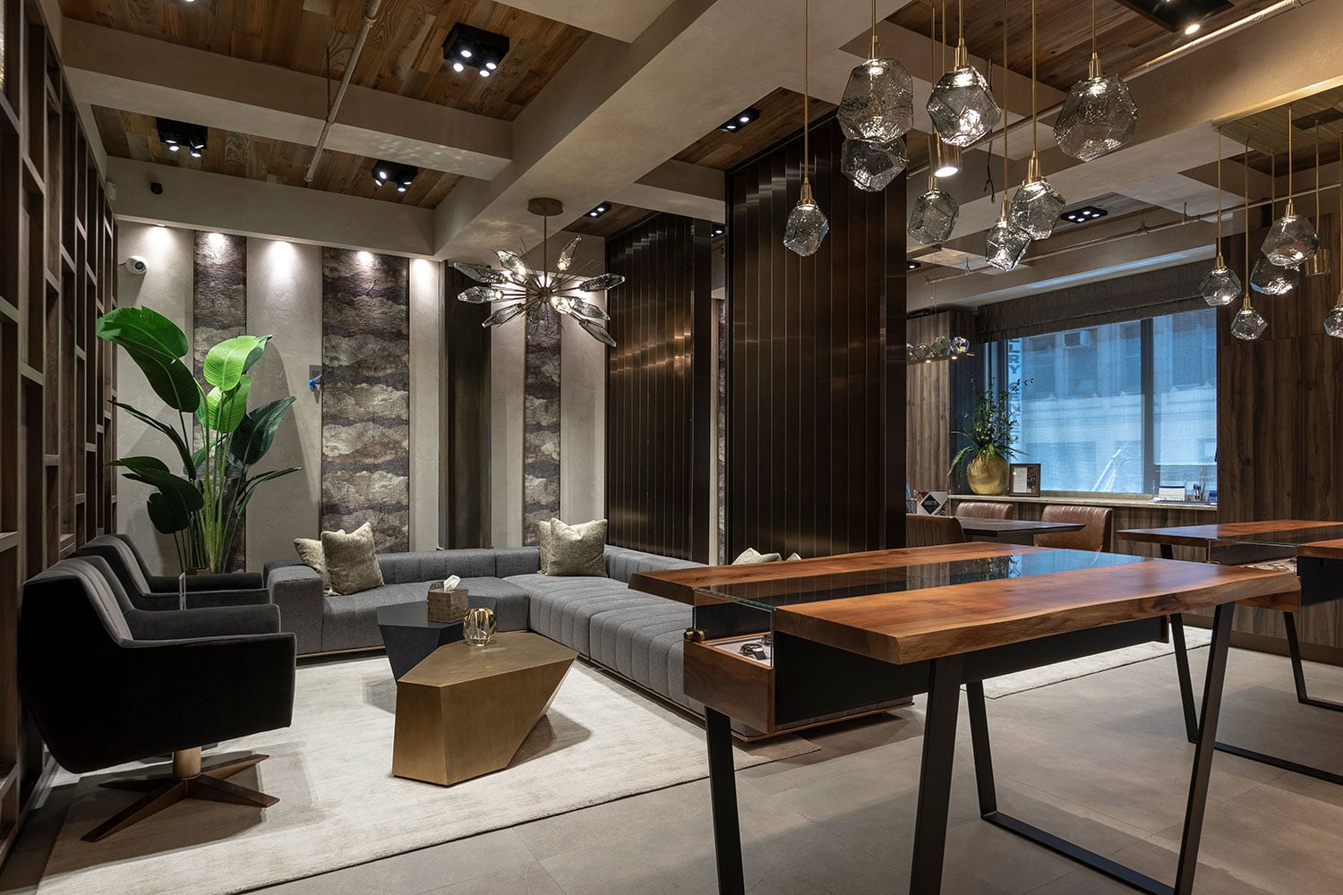 Trendy, Upscale, Luxury Watch Boutique with Couches, Fancy Lighting, and Glass Watch Displays.