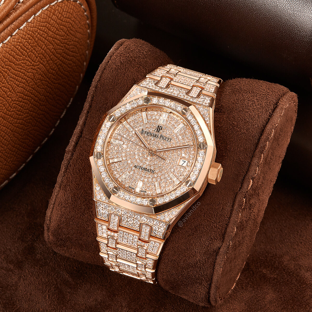 Diamond-Pave Rose Gold Timepiece Displayed on a Watch Cushion.