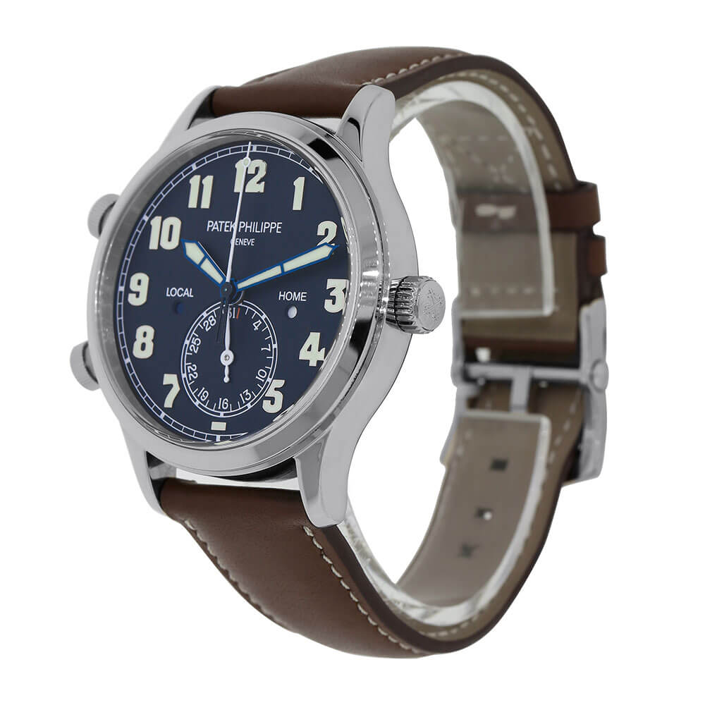 White Gold 42 mm Patek Philippe Timepiece with Blue Dial and Brown Strap Displayed on a Clear C-Ring on a White Background.