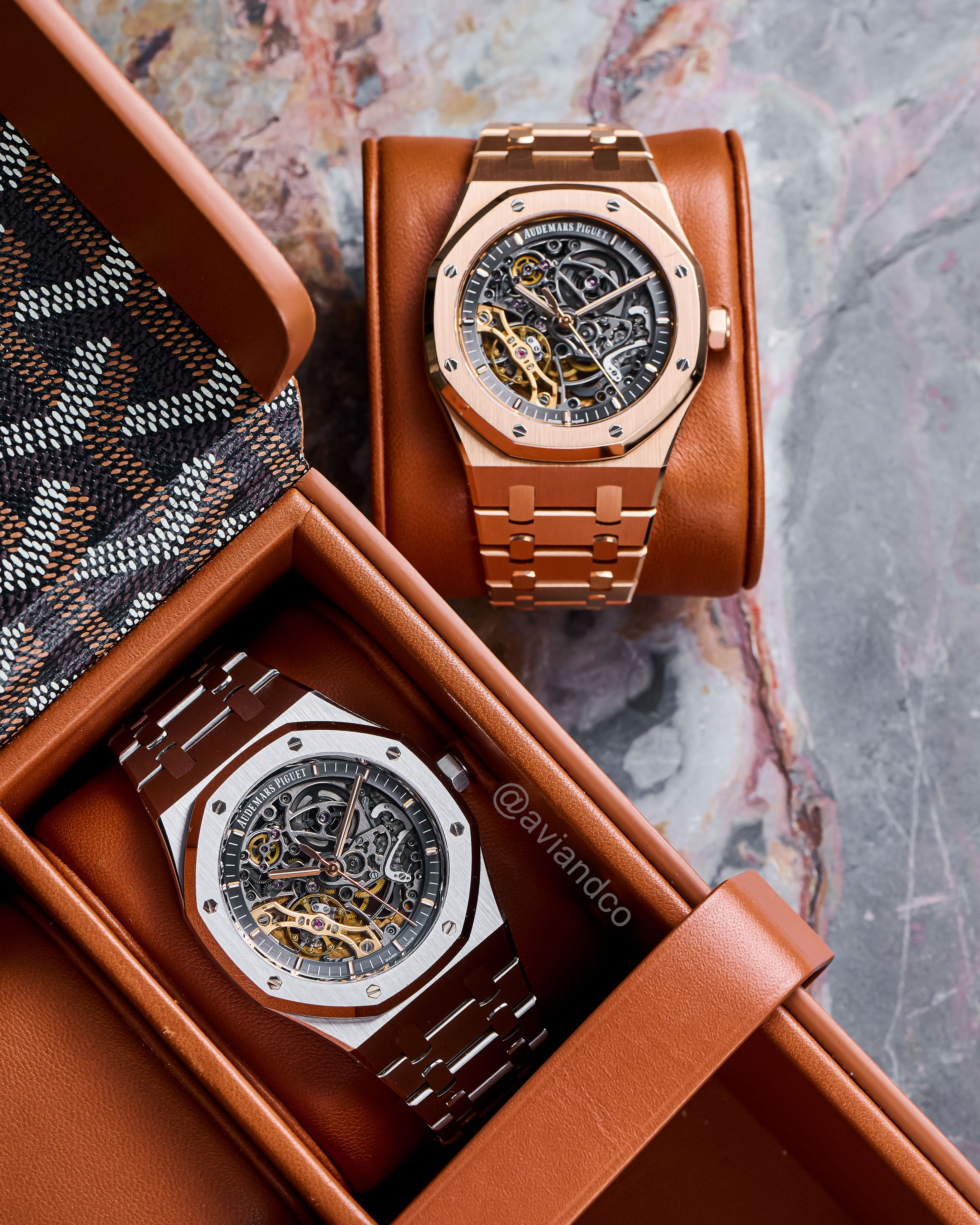 Two Skeleton Dial AP Luxury Watches Displayed on Watch Cushions.