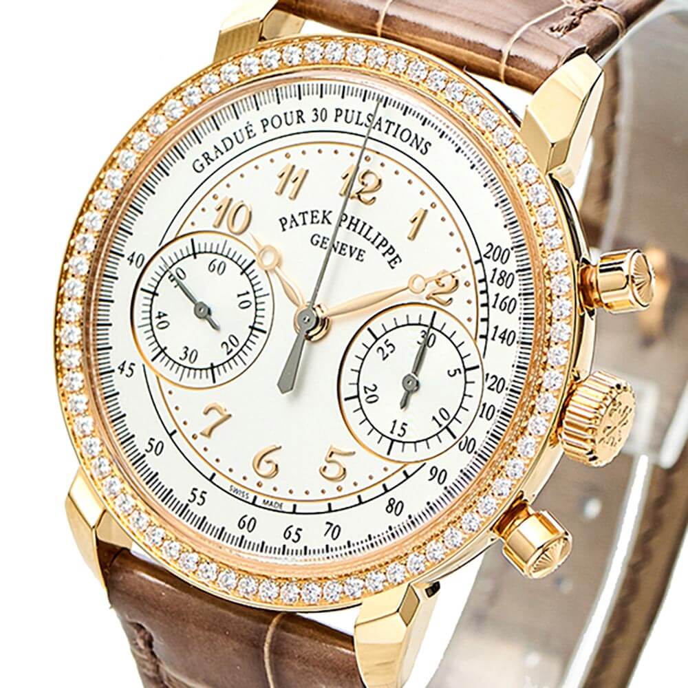 Rose Gold Luxury Timepiece with White Dial, Gem-set Bezel, and Brown Leather Bracelet Displayed on a C-ring.