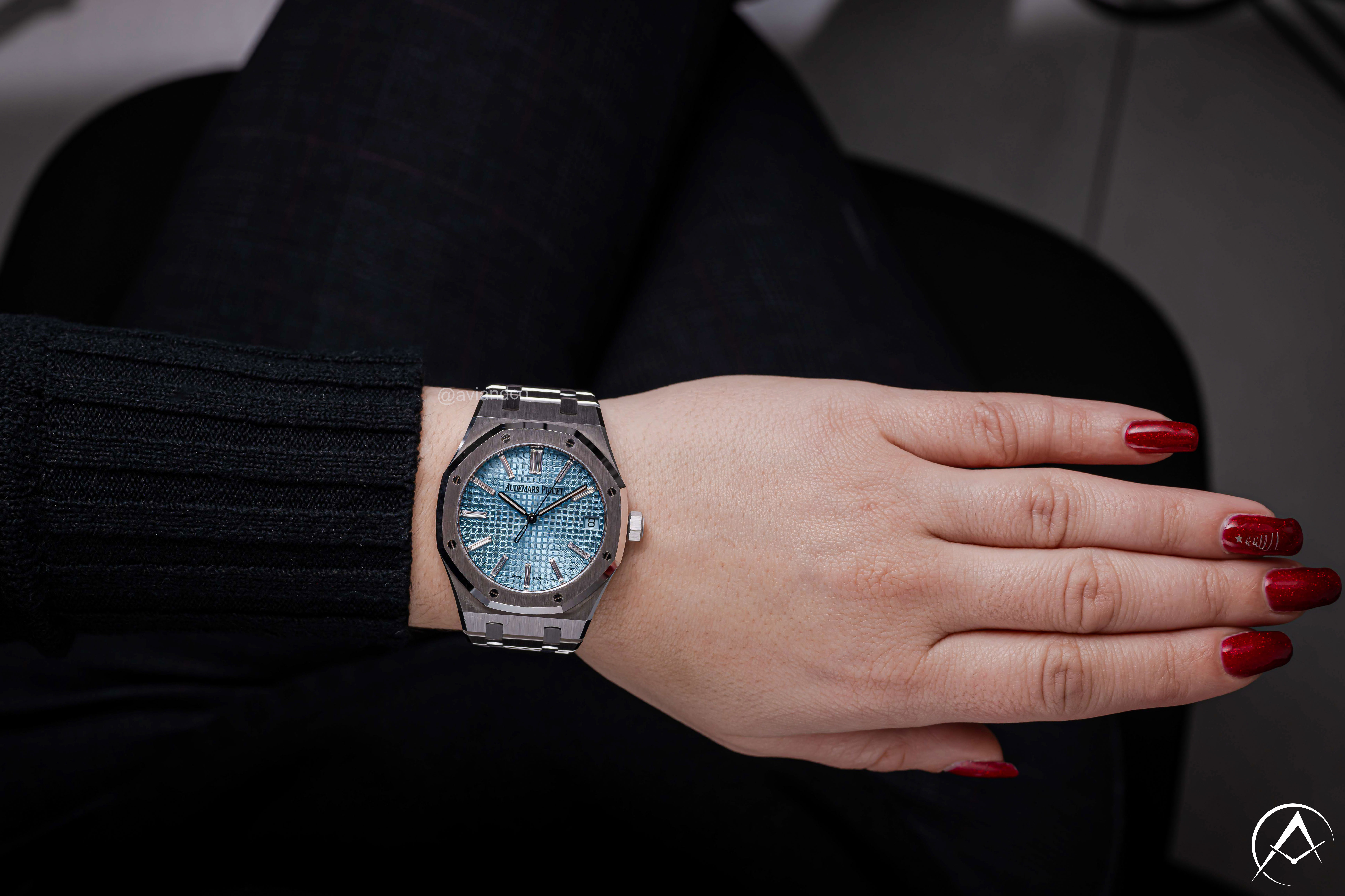 Ladie’s Wrist Shot of Stainless Steel Luxury Timepiece with Large Case Size, Blue Dial, Index Hour Markers, and Date Function.