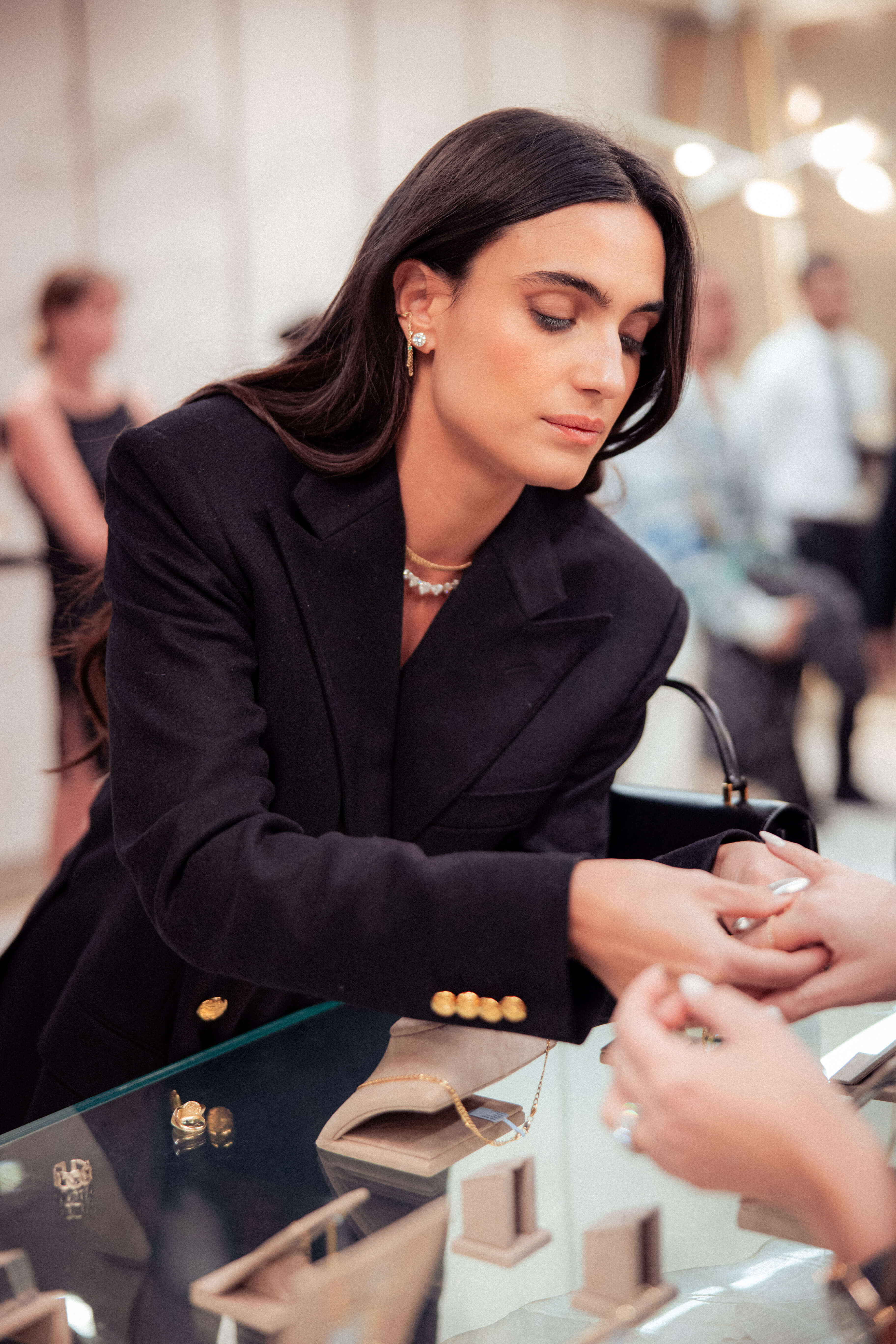 Isabela Grutman Sharing Her 14K Yellow Gold Jewelry Collection in Miami's Boutique During Art Basel.