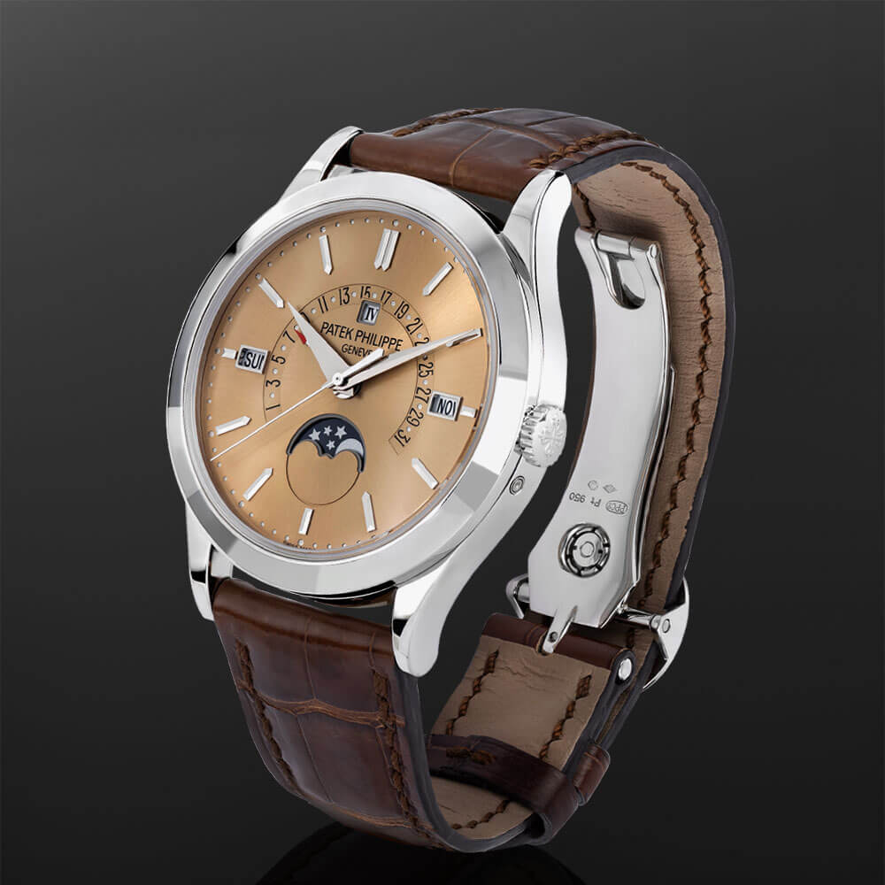 Platinum 39.5 mm Luxury Timepiece with Brown Index Dial and Brown Leather Bracelet Displayed on a C-ring.