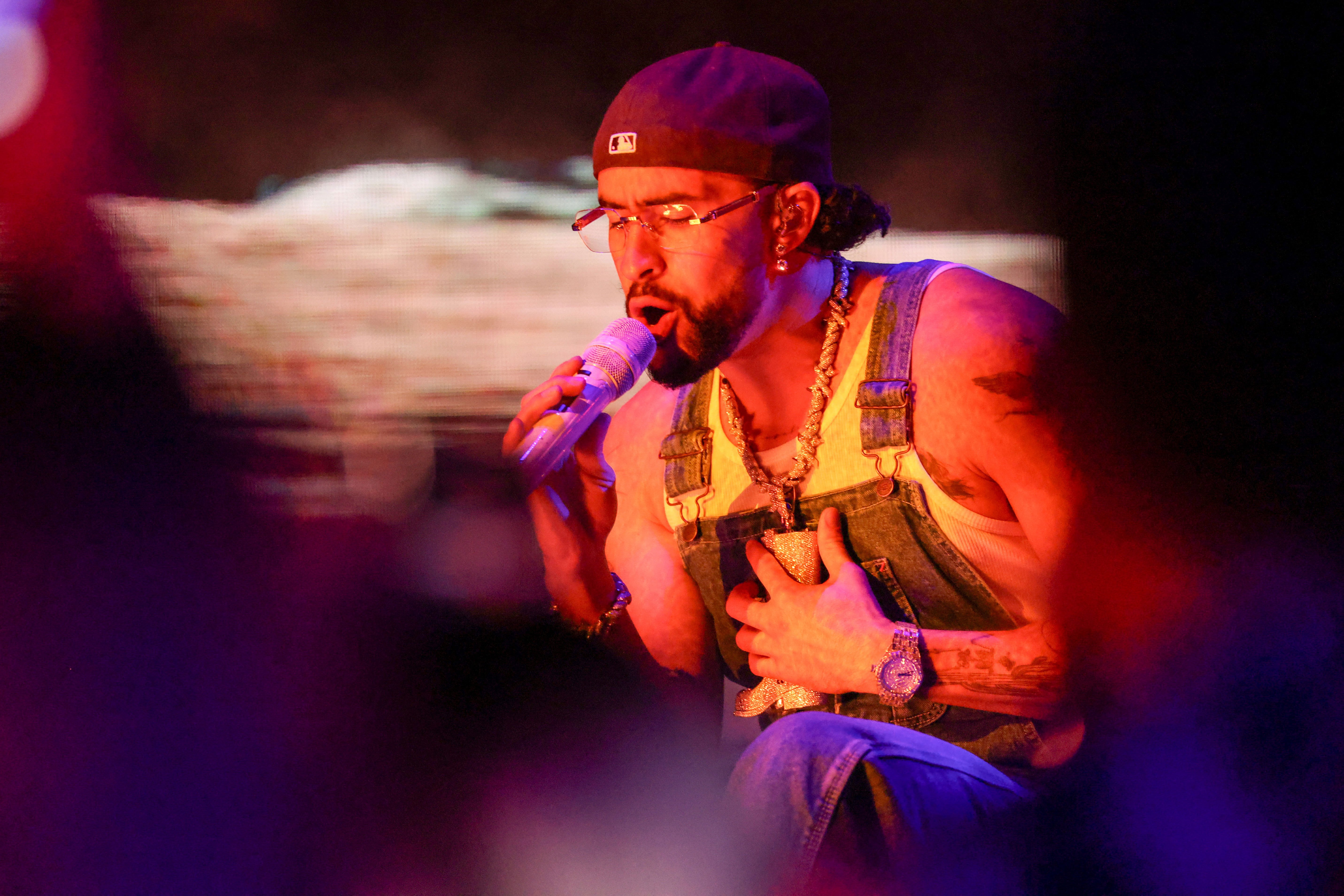 Puerto Rican Rapper and Singer Bad Bunny Performs at the 2023 Billboard Latin Music Awards Wearing Overalls and the Avi & Co. Limited Edition Timepiece.
