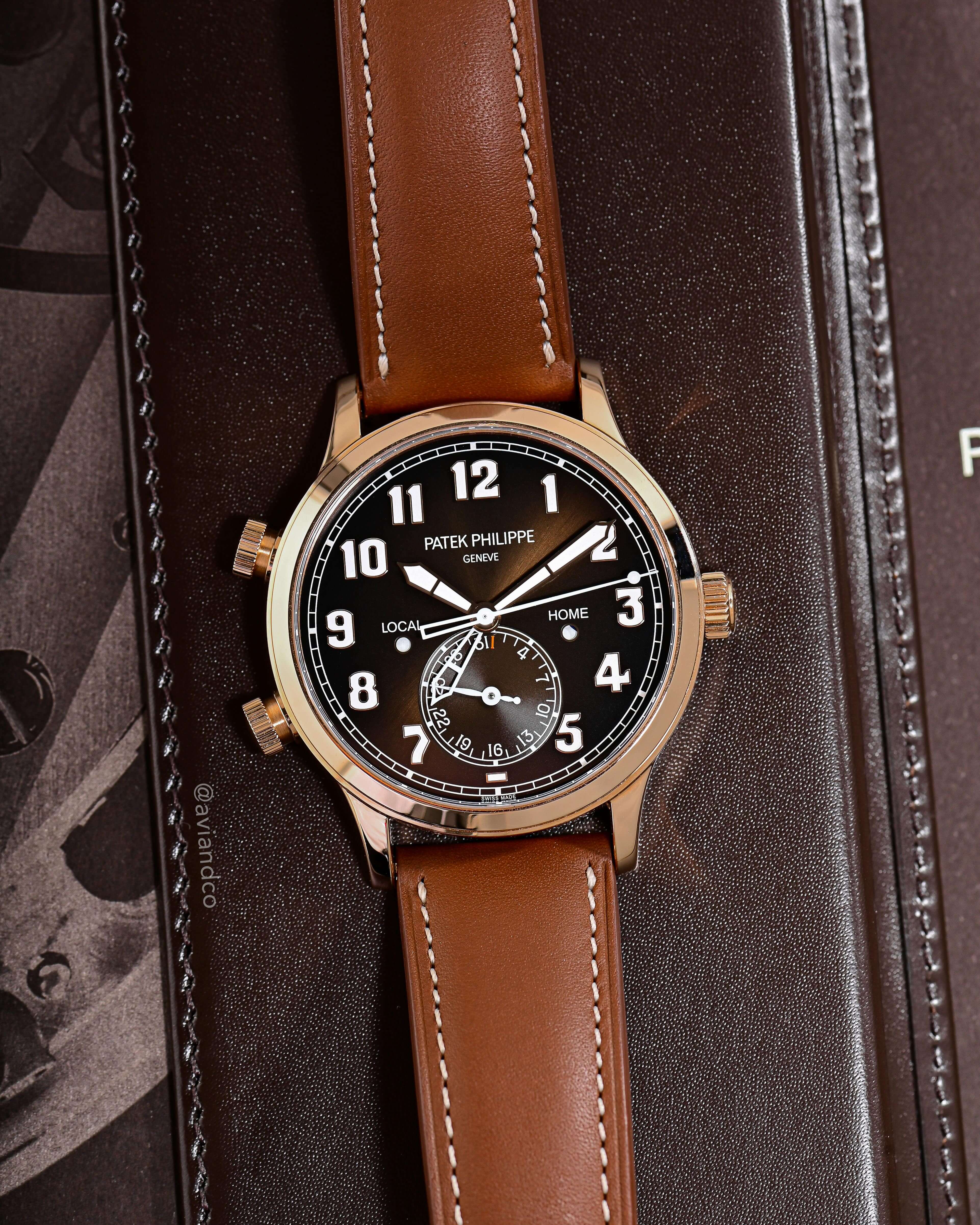 Patek Philippe Luxury Watch with Brown Dial, Arabic Hour Markers, and Brown Leather Strap.