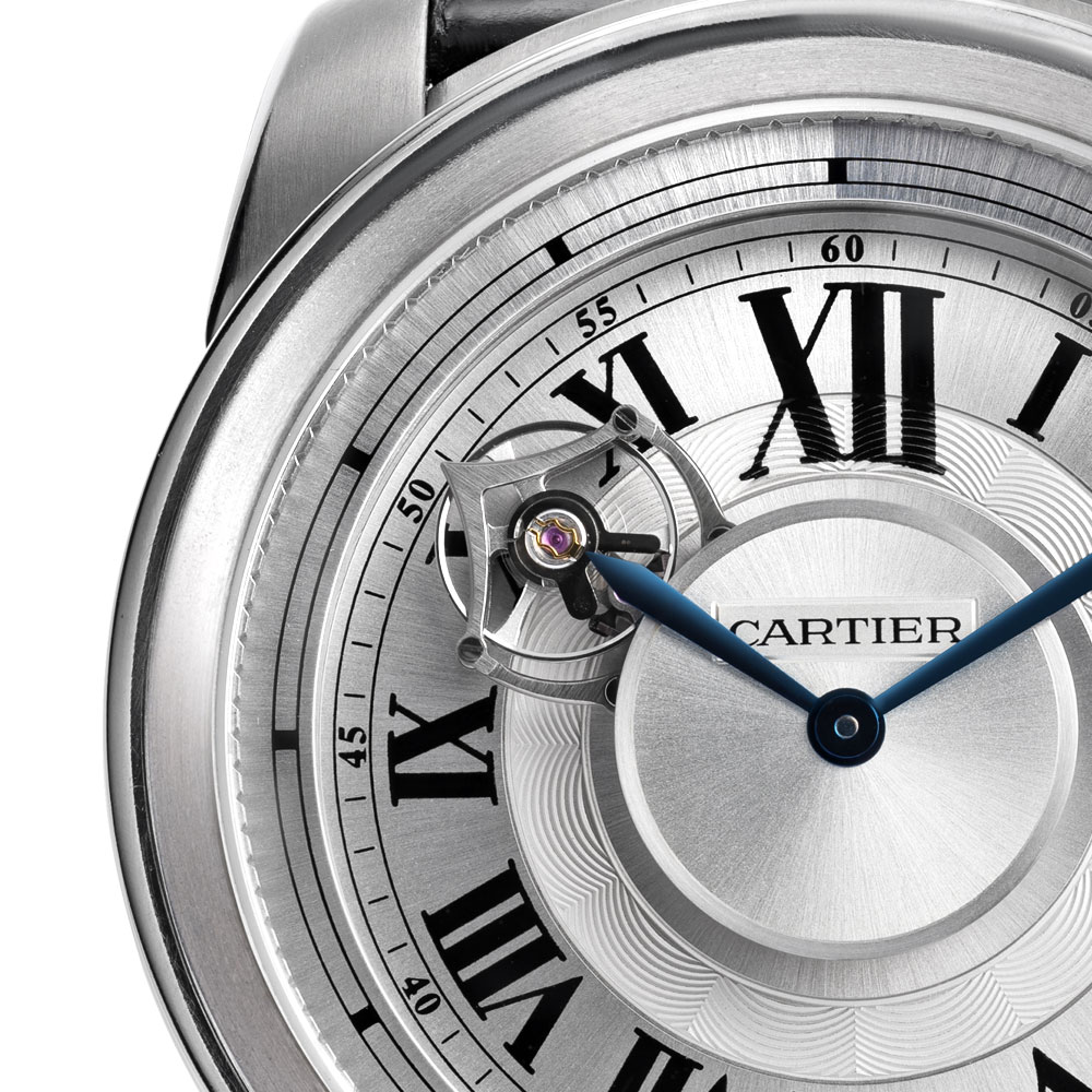 Close Up of a Timepiece with Silver Dial and Black Roman Numerals.