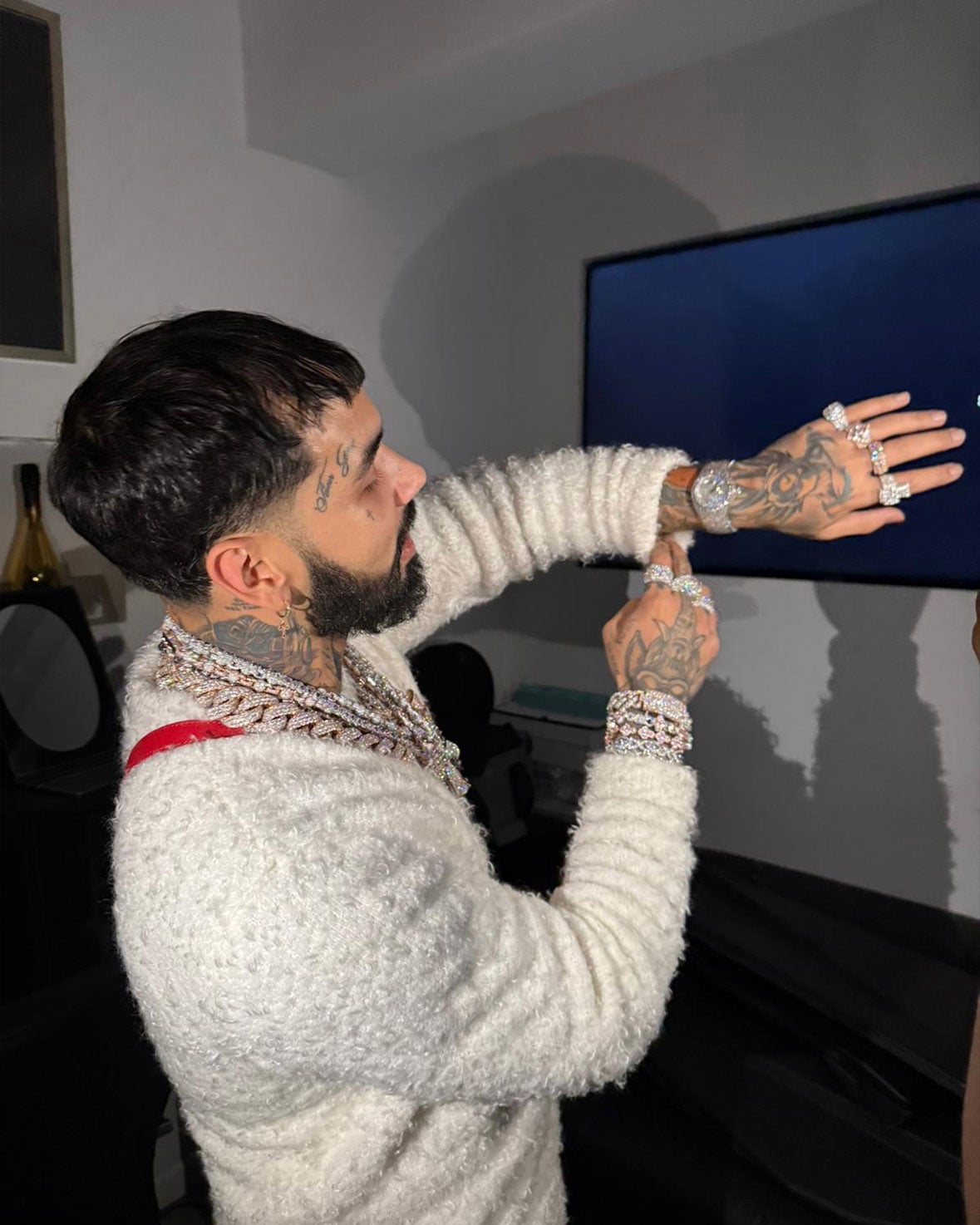 Anuel tries on luxury watches at Avi & Co.’s Miami location