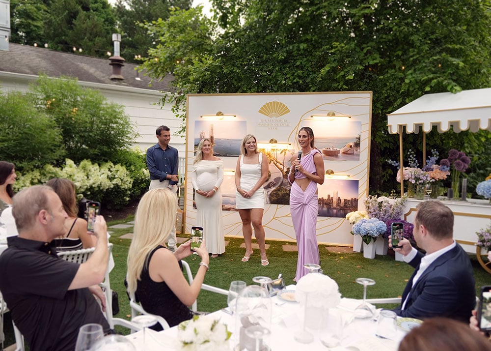Camille Fishel speaks at Haute Living Hamptons event