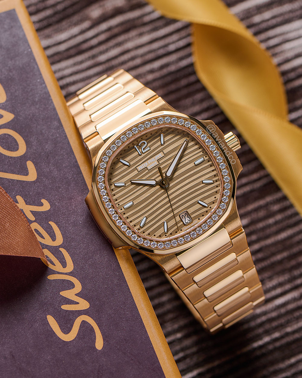 Patek Philippe Nautilus 7118/1200R-010, 18K Rose Gold, Diamond Bezel, Gold Opaline Dial