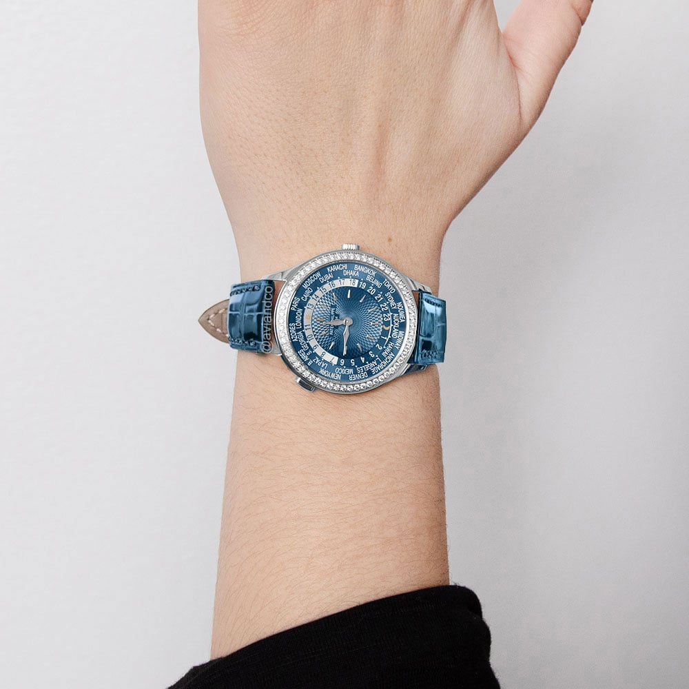 Patek Philippe “World Time” 18K white gold, diamond bezel, blue dial