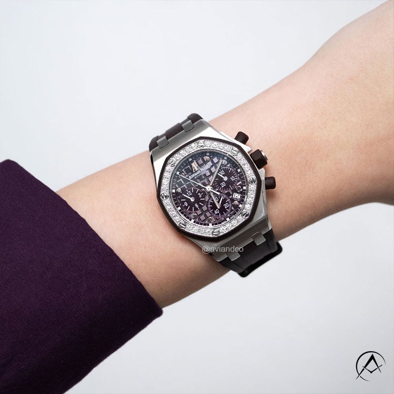 White Gold Audemars Piguet Royal Oak Offshore Chronograph with 37 mm Case, Gem Set Bezel, Blue Rubber Bracelet, and Date Function.