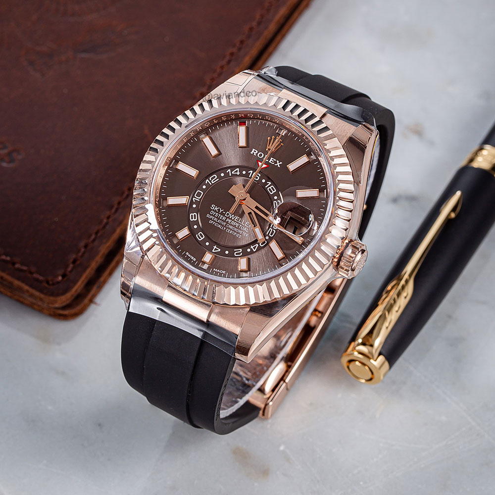 White Gold Rolex Sky-Dweller Timepiece with Gem-Set Bezel Displayed on a C-Ring with a Black Background.