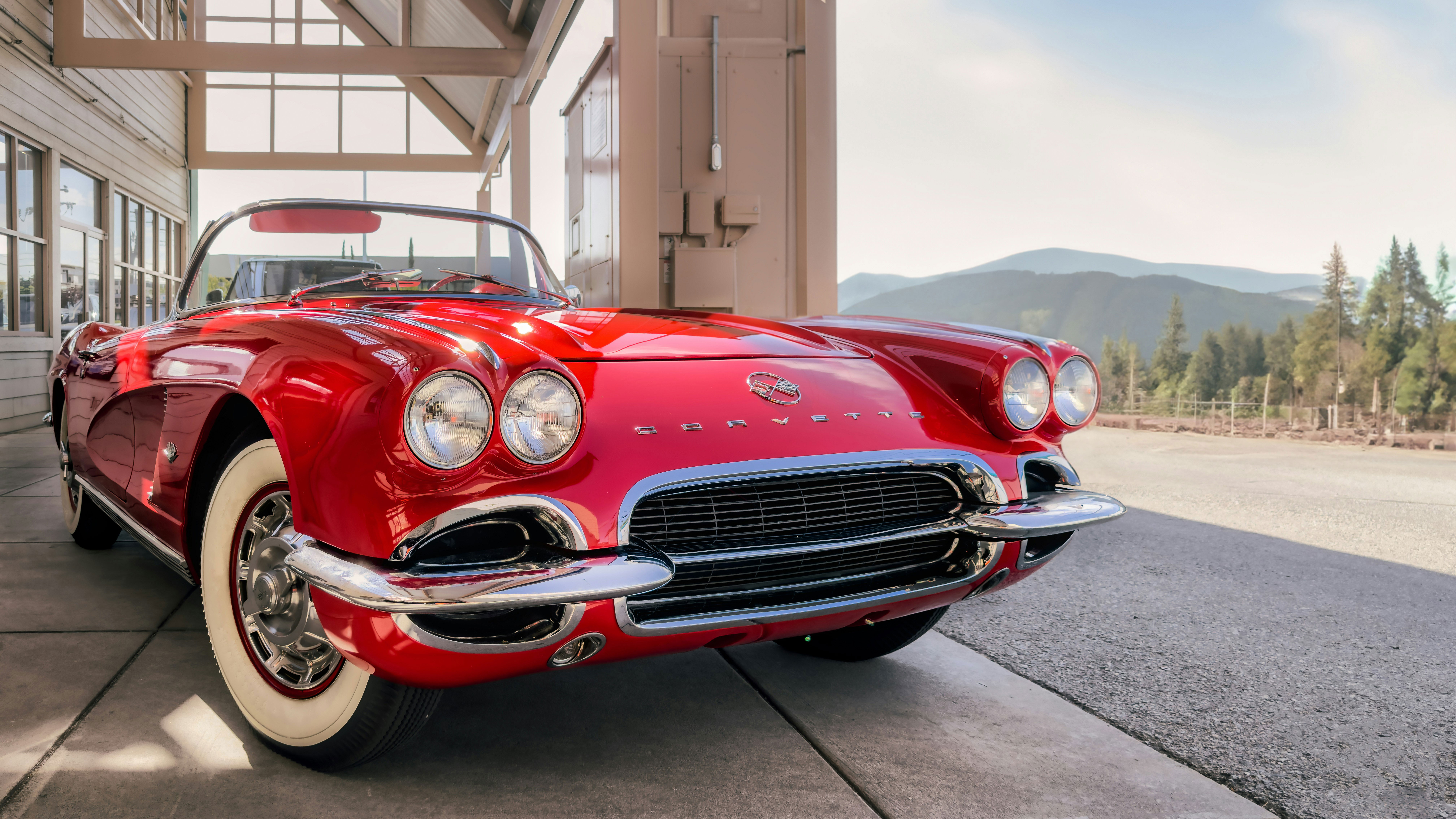 Classic Chevrolet Corvette red car on mountain background