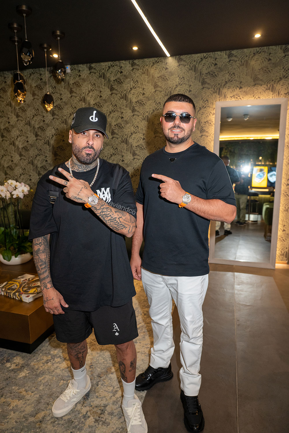 Nicky Jam and Avi Hiave wearing Avi & Co. Iced Collection: Color in Motion, Orange Strap