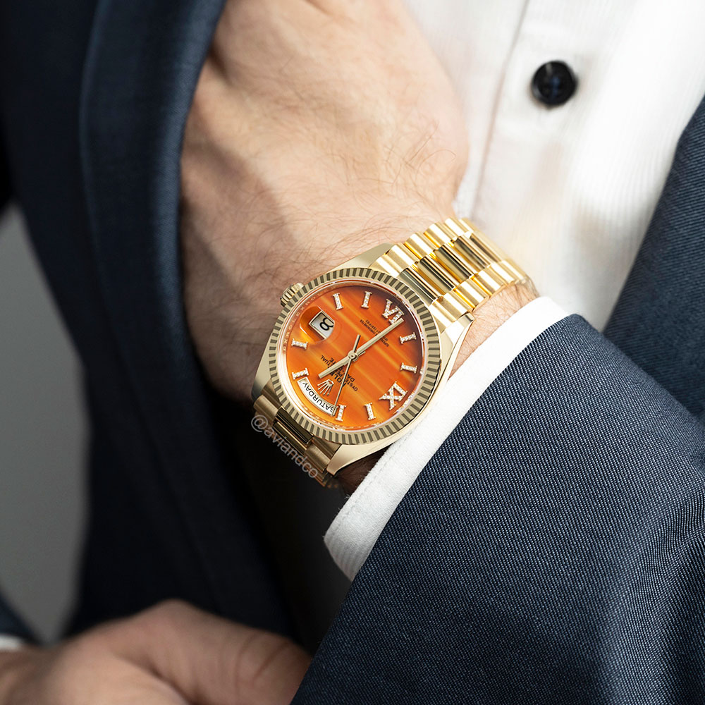 Rolex Day-Date 36, 18K Yellow Gold, Orange Carnelian Roman Diamond Dial