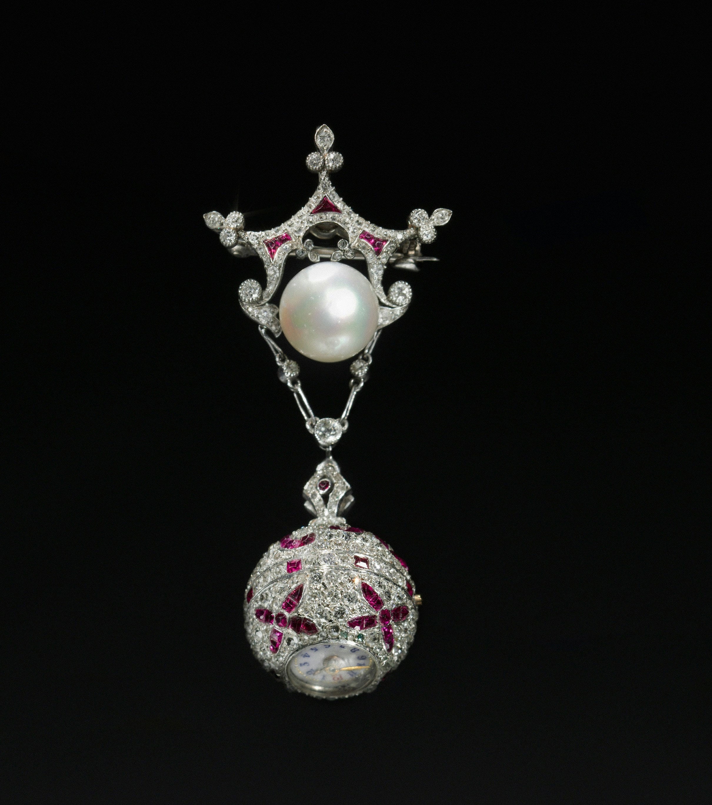 Rubies set in a piece of white gold and pearl jewelry